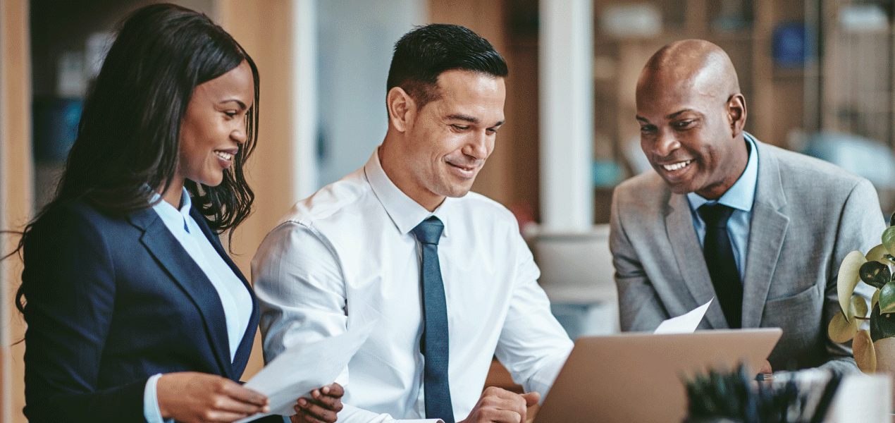 Three diverse legal professionals collaborating in an office