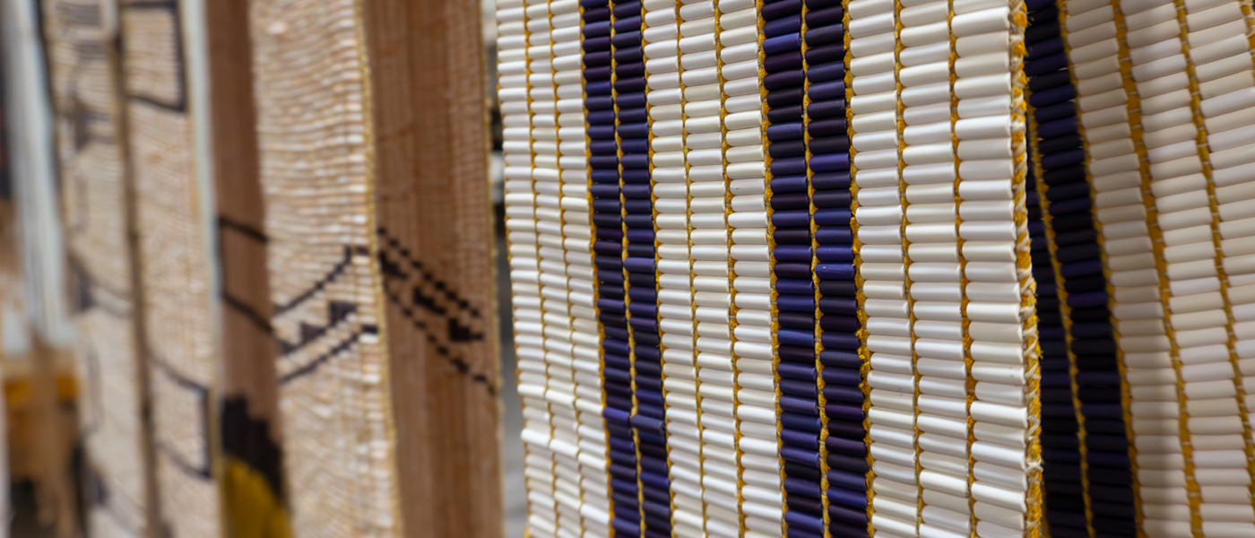 A close-up view of a wall hanging curtain featuring an intricate blue and white design