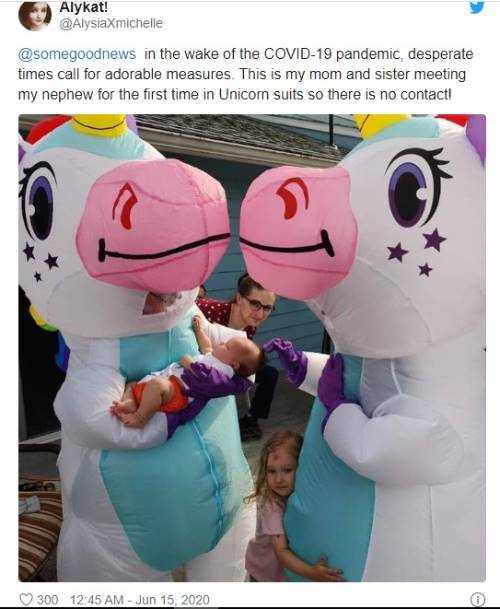 Tweet showing two people in inflatable unicorn costumes holding a baby, with a child standing nearby. The tweet explains it's a creative, no-contact way for family members to meet a baby during the COVID-19 pandemic.