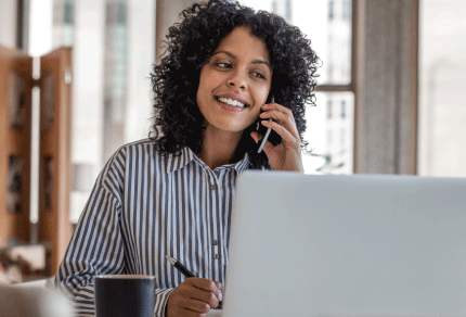 Legal professional participating in a virtual meeting from her office