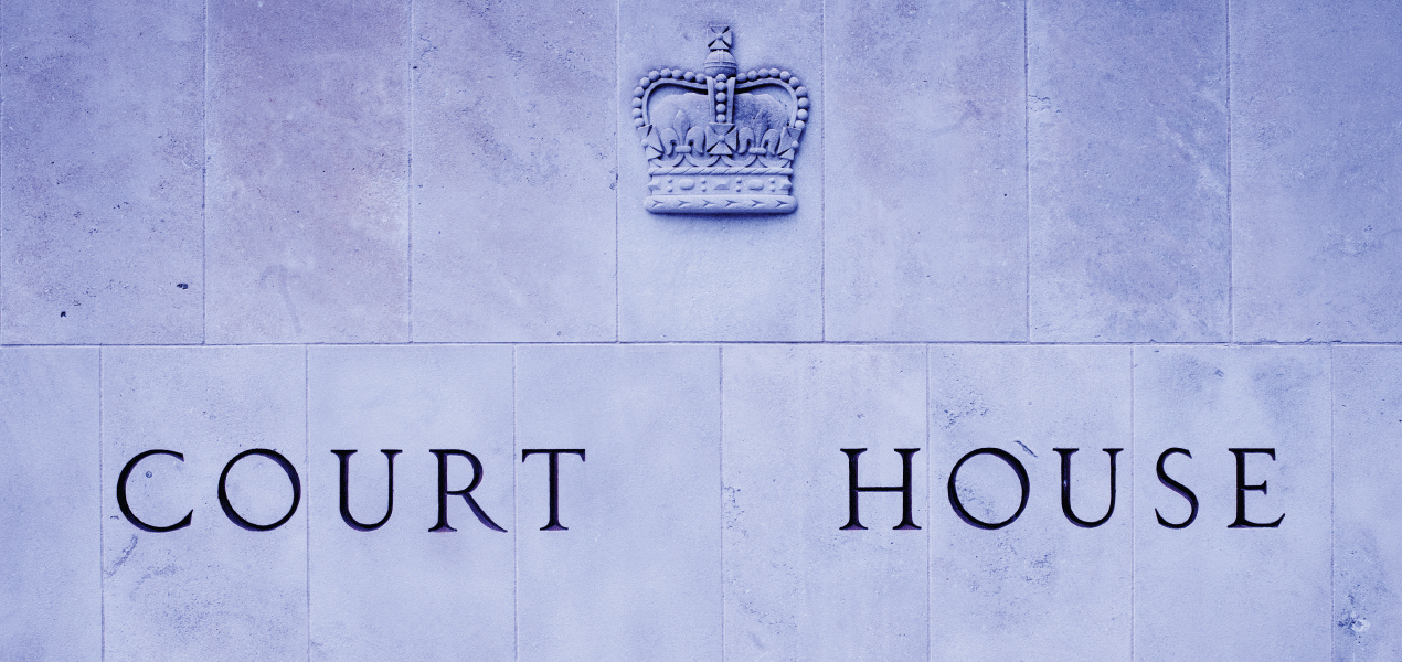 Image of a brick wall with the words Court House